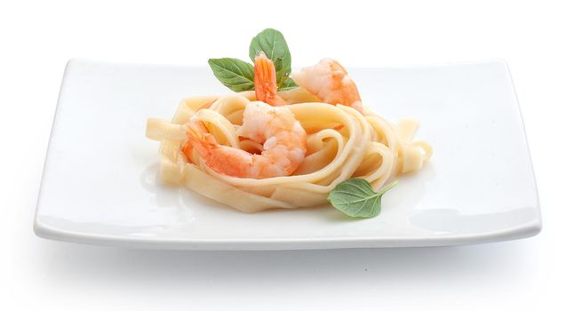 Boiled shrimps with pasta on the plate