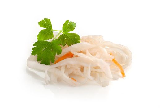 Isolated handful of sauerkraut with carrot and parsley on the white background