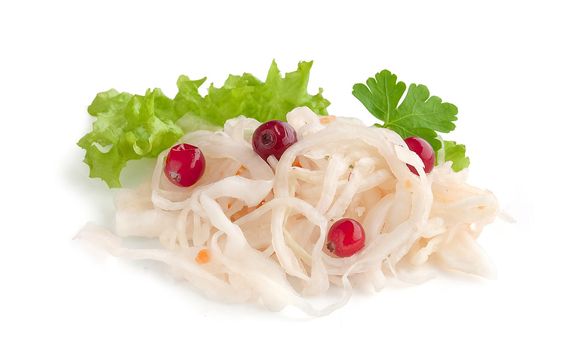 Isoalted handful of sauerkraut with red cranberry, fresh green parsley and lettuce