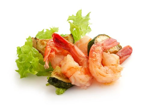 Fried shrimps with zucchini and fresh green lettuce