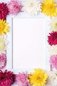 Picture frame mockup decorated with chrysanthemum flowers