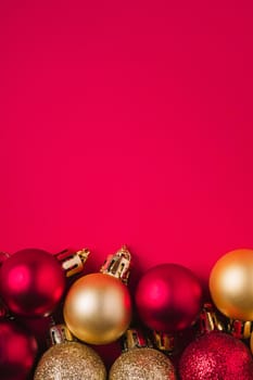 Christmas composition. Purple and golden ornament and bauble decorations. Copy space