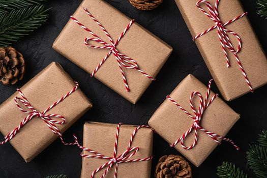 Christmas holidays composition. Eco gift boxes, pine cones and fir-tree.