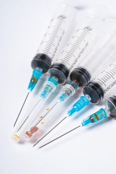 Dirty used plastic syringes, isolated