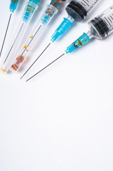 Dirty used plastic syringes, isolated with copy space