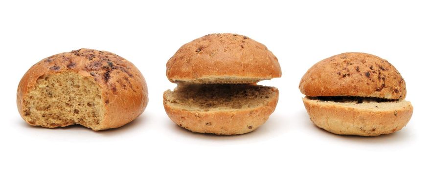 Three funny cut flax burger buns for a hamburger isolated on a white background