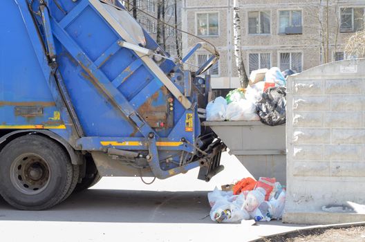 Garbage truck loading garbage at the city dump.Regular cleaning of street waste. 