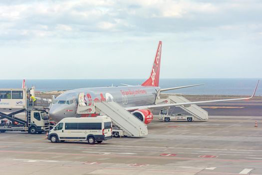 TENERIFE, SPAIN - March 21, 2021: A plane with the inscription Friendly Low Fares at the southern airport of the island of Tenerife. Stock photo.