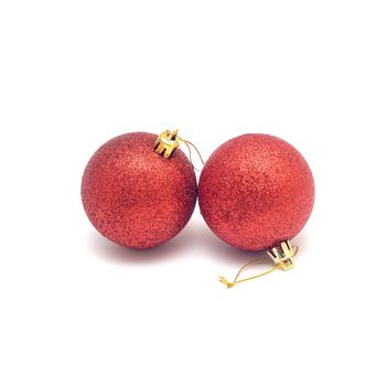 Two red Christmas balls isolated on a white background