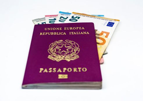 Italian travel passport with some euro banknotes isolated on a white background. European Union and single currency. Travel and cash