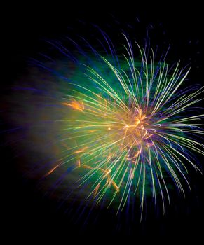 Colorful fireworks isolated on black sky background.