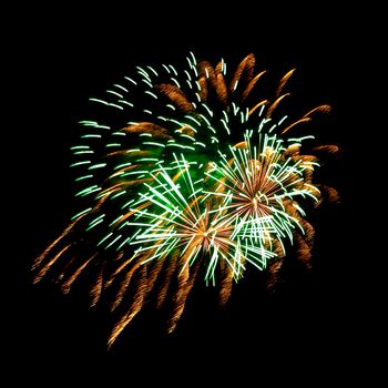 Colorful fireworks isolated on black sky background.