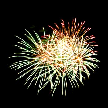 Colorful fireworks isolated on black sky background.