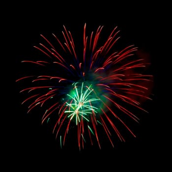 Colorful fireworks isolated on black sky background.