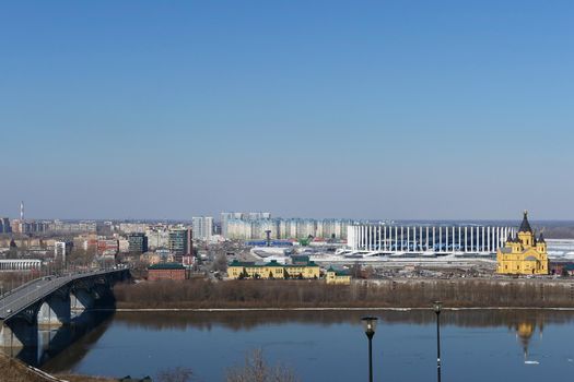 City panorama. A modern city, a metropolis on the river bank and a beautiful bridge over the river. High quality photo