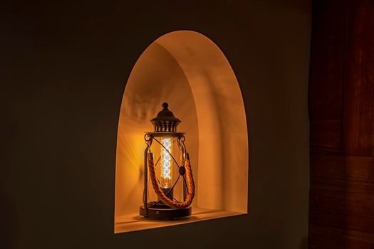 Old fashioned lantern with led lights. Vintage decoration home 