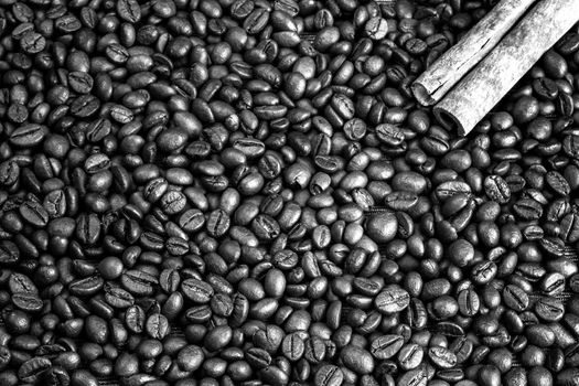 Cinnamon on the coffee beans. Coffee love background. Black and white