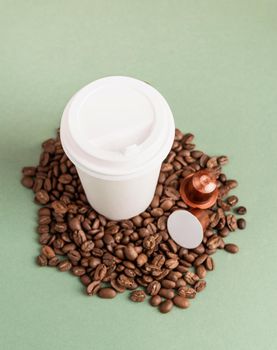 Zero waste and ecology concept. Eco-friendly disposable white paper cup with coffee beans and capsules, mock up design