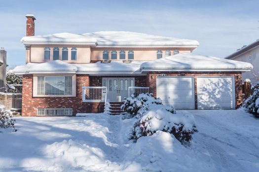 Big residential house in snow on winter season in Canada