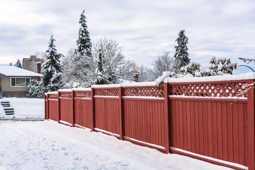 Wooden fence along a road on winter season in Vancouver, Canada.