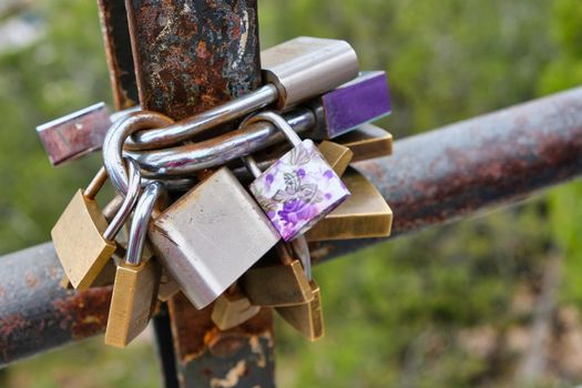 Love Commitment padlocks in a fence