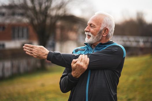 Active senior man is exercising. Healthy retirement lifestyle.