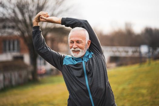 Active senior man is exercising. Healthy retirement lifestyle.