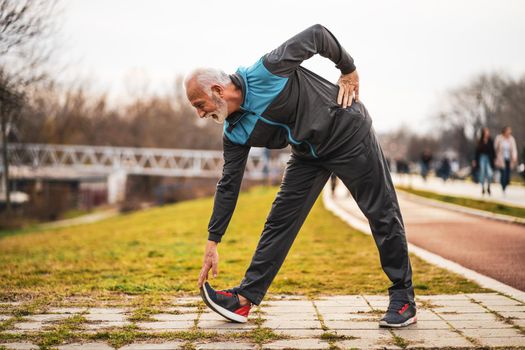 Active senior man is exercising. Healthy retirement lifestyle.
