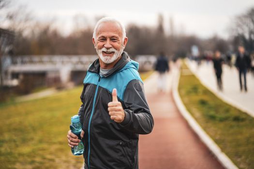 Happy senior man is ready for exercising. Healthy lifestyle.