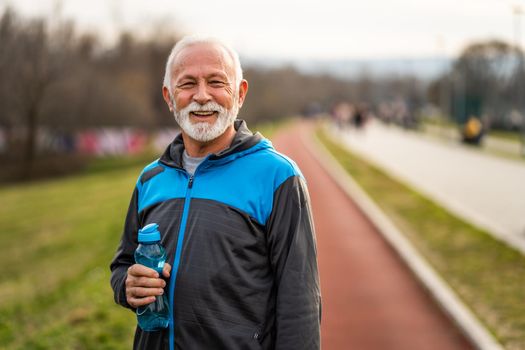 Happy senior man is ready for exercising. Healthy lifestyle.