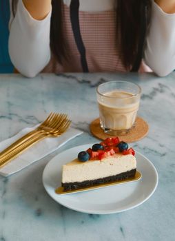 mixed berry cheese cake with dirty coffee background