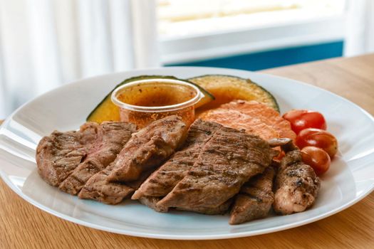 beef steak with grilled carrot and pumpkin