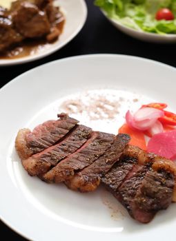picanha beef steak with salad and stew