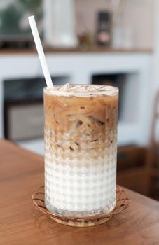 iced caramel latte coffee on wood table