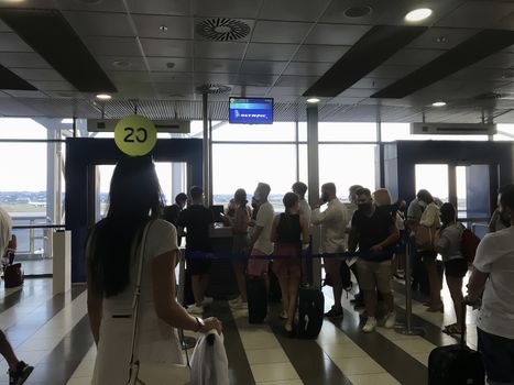 People with face protection prior to departure in International Airport Macedonia.