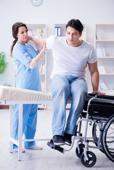 Patient undergoing rehabilitation recovery programme with doctor