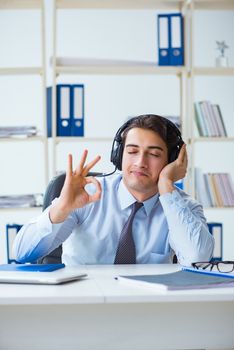 Sales assistant listening to music during lunch break