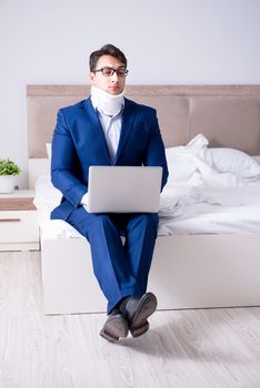 Businessman with neck injury working from home