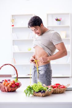 Young man in healthy eating and dieting concept