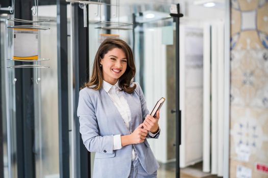 Woman owning small business bath store. Female entrepreneur concept. Happy businesswoman portrait.