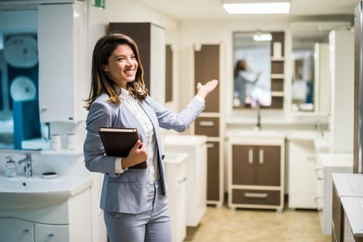 Woman owning small business bath store. Female entrepreneur concept. Happy businesswoman portrait.