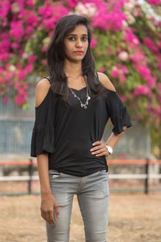 Beautiful young girl posing in a park, Portrait