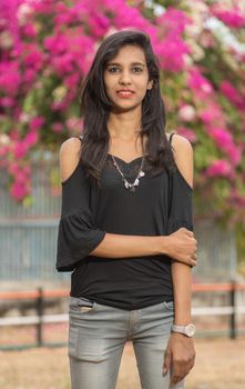 Beautiful young girl posing in a park, Portrait