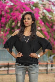 Beautiful young girl posing in a park, Portrait