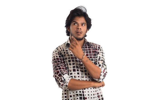 Young man posing on a white background