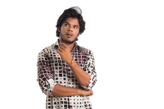 Young man posing on a white background