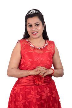 Young girl in red dress posing on white background