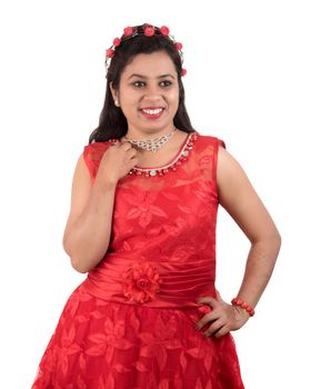 Young girl in red dress posing on white background