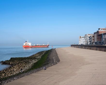 ship on westerschelde near vlissingen boulevard sets out for north sea on sunny spring day in dutch province of zeeland