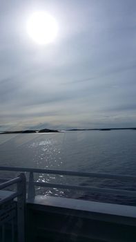 The ferry is arriving in Visby in Gotland, Sweden in May. The sun is very strong